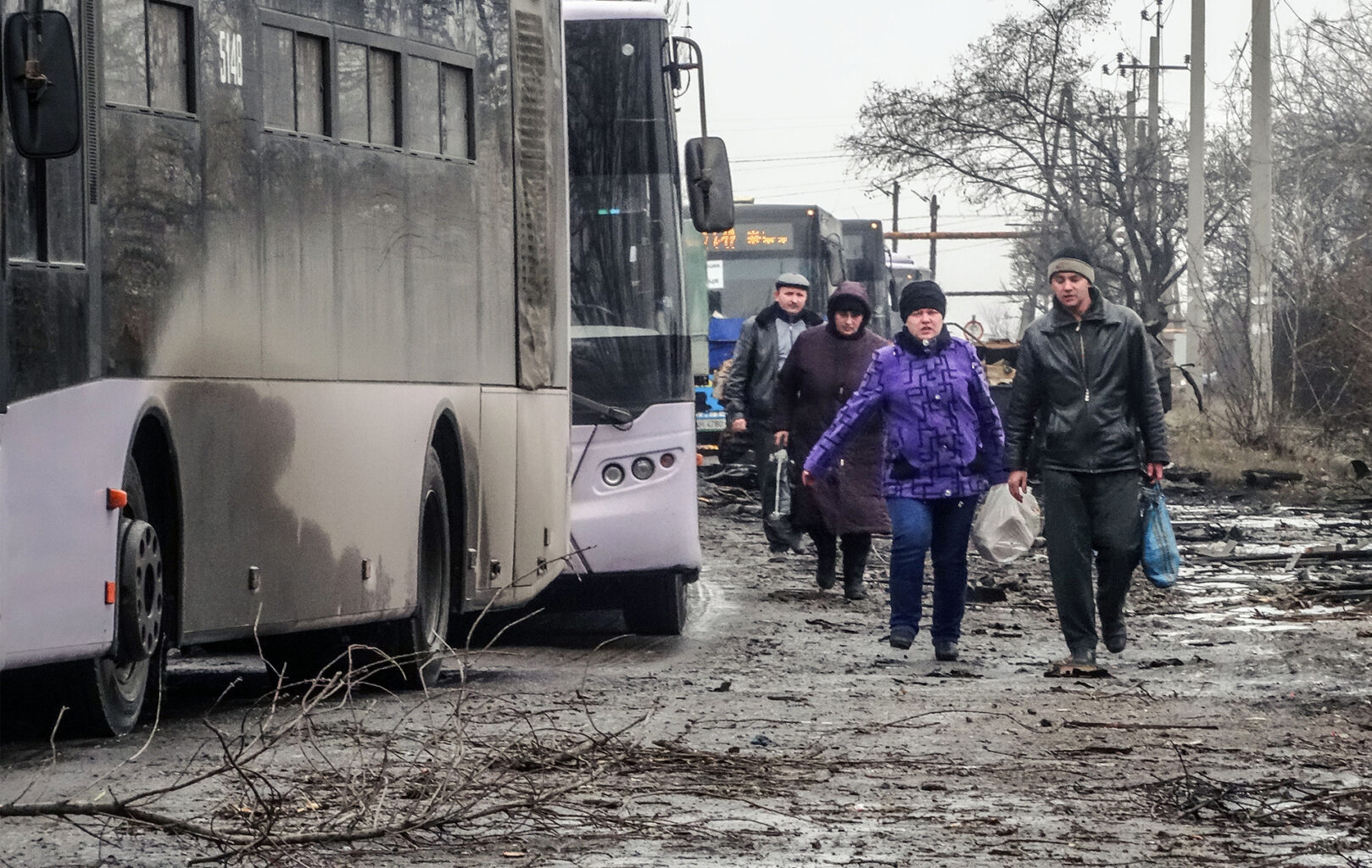 DONETSK BASIN, UKRAINE - FEBRUARY 6, 2015: A bus column for refugees, escorted by pro-Russian rebels, which moves between Debaltseve and Uglegorsk cities